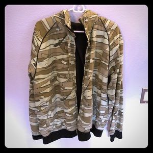 Globe wind breaker/shell with hood. Reversible.